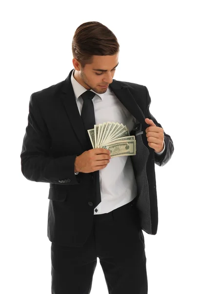 Homem elegante em terno segurando dinheiro isolado em branco — Fotografia de Stock