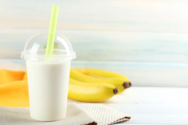 Plastic cup of milkshake — Stock Photo, Image