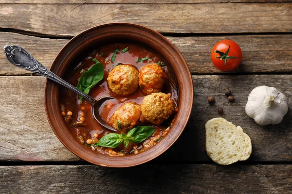 Meat balls with tomato sauce, on wooden background — Stock Photo, Image