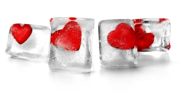 Red hearts in ice cubes isolated on white — Stock Photo, Image