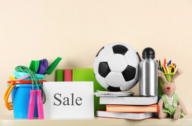 Goods for sale, on light wall background clipart