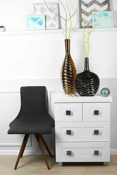 Modern vases on commode in room — Stock Photo, Image