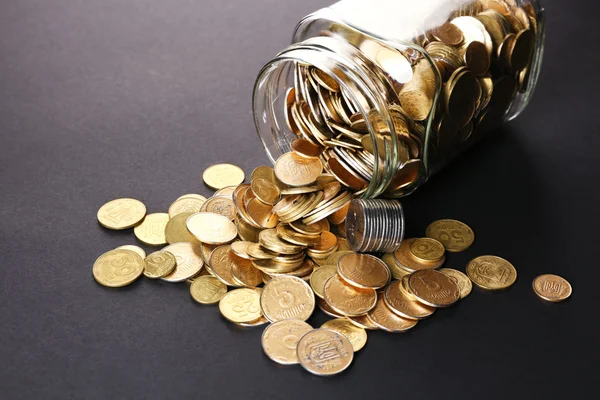 Glass jar with coins — Stock Photo, Image