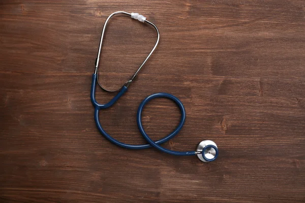 Stethoscope fából készült háttér — Stock Fotó