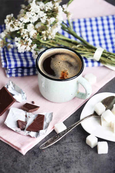 Cup of flavored coffee with chocolate on table with napkin, closeup — Stock Photo, Image