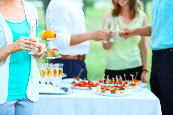 Guests drink champagne on wedding ceremony