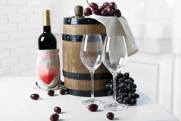 Beautiful still life with wine and grape on table — Stock Photo, Image