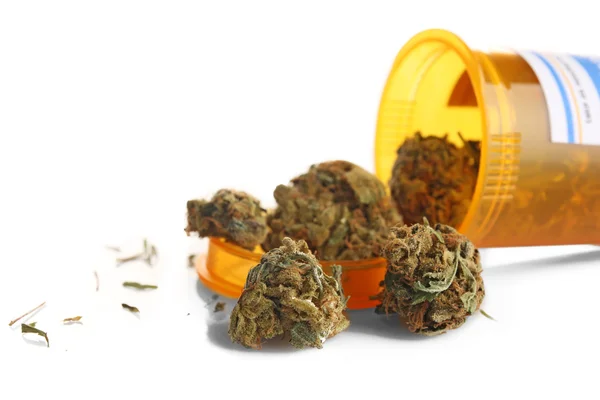 Fles van droge medische cannabis geïsoleerd op wit — Stockfoto