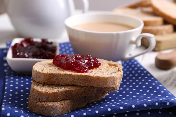 Fresh toast with jam and cup of coffee on table close up — ストック写真