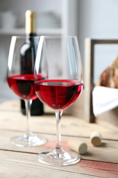 Still life of wine and bread on light background — Stock Photo, Image