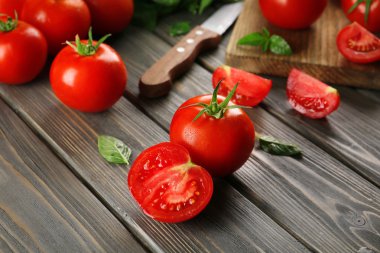 Red tomatoes and knife