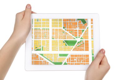 hands holding tablet pc with map