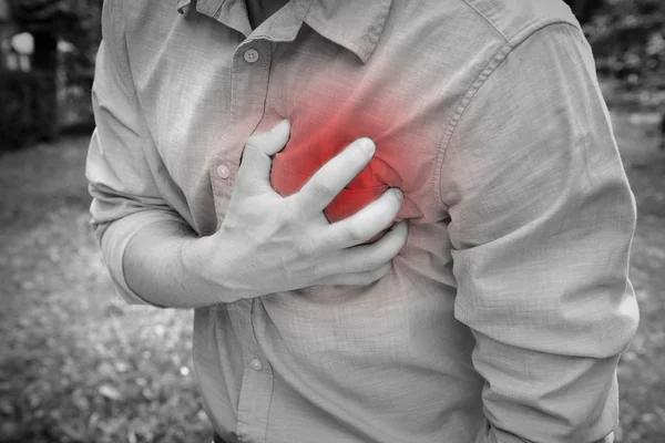 Man having chest pain — Stock Photo, Image