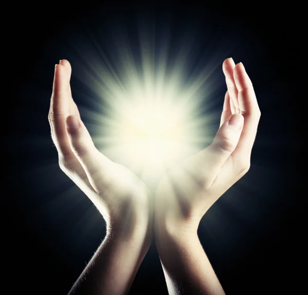 Light in young woman hands — Stock Photo, Image
