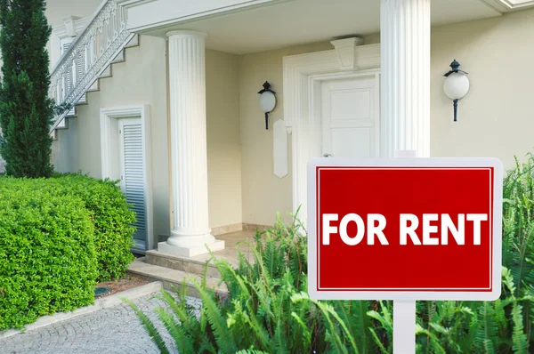 Real estate sign in front of house — Stock Photo, Image