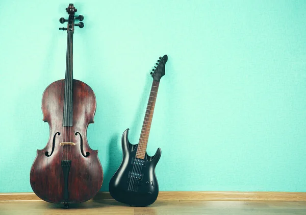 Musical instruments on turquoise background — Stock Photo, Image