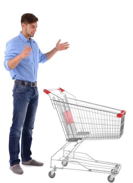 Joven con carro de la compra vacío, aislado en blanco — Foto de Stock