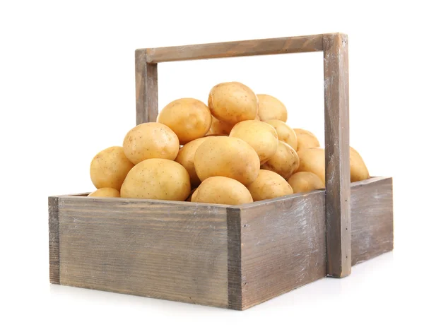 Batatas novas em mesa de madeira isoladas em branco — Fotografia de Stock