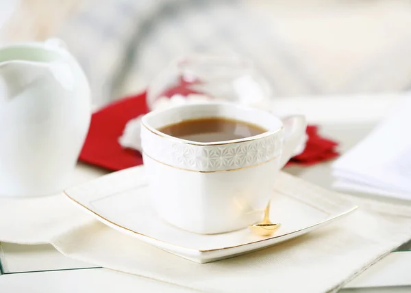 Cup of tea on table in living room — Stock Photo, Image