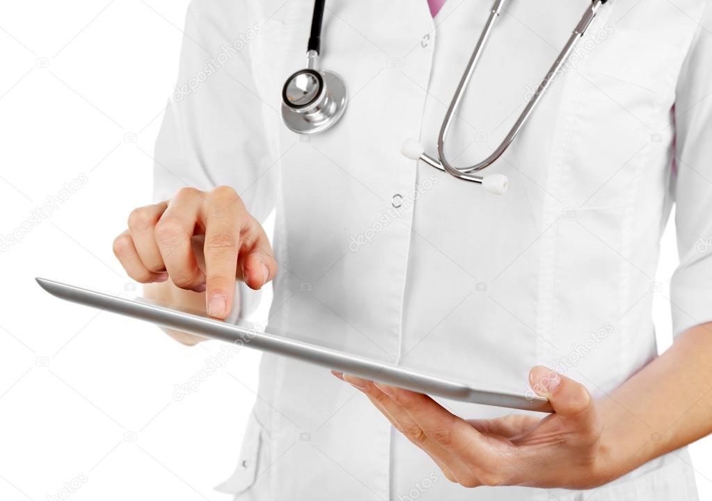 Female doctor working on digital tablet isolated on white