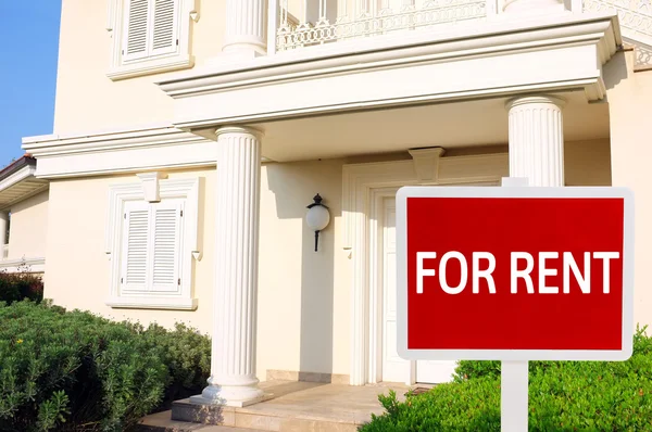 Real estate sign in front of new house for rent — Stock Photo, Image