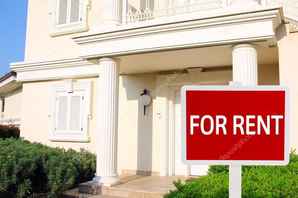 Real estate sign in front of new house for rent