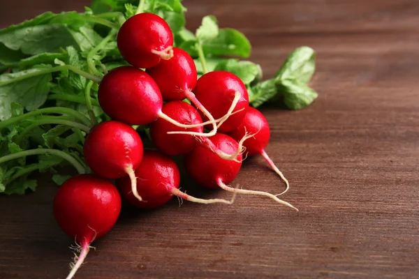 stock image Fresh red radish on wooden background