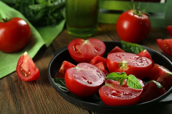 Red tomatoes on plate — Stock Photo, Image