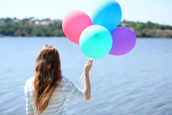 Girl with colorful balloons — Stock Photo, Image