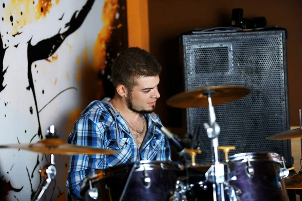 Excited drummer on bright background — Stock Photo, Image