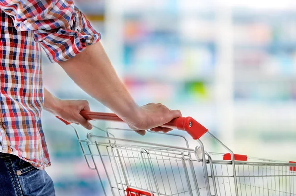 Man with shopping cart — Stock Photo, Image