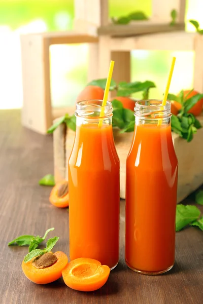 Bottles of apricot juice — Stock Photo, Image