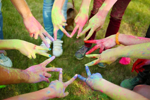 Hands of young people with Indian dyes — Stock Photo, Image