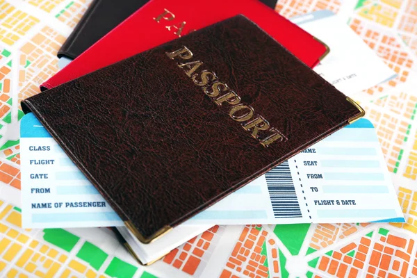 Passports with tickets on map background — Stock Photo, Image