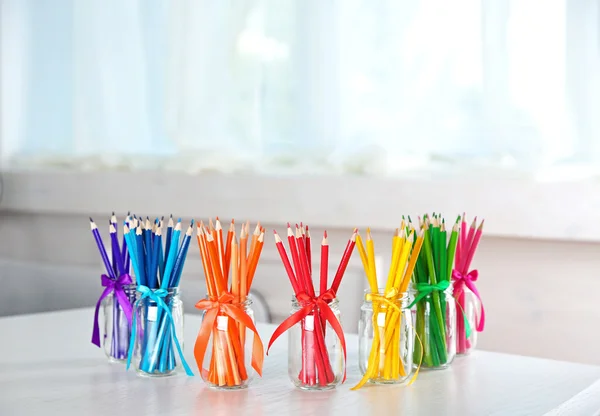 Jars with colorful pencils — Stock Photo, Image