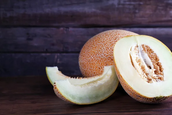 Ripe melon on wooden background — Stock Photo, Image