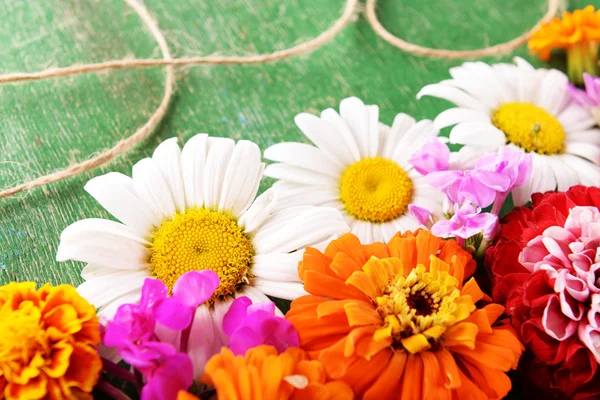 Fresh colorful flowers on wooden table, closeup — Stock Photo, Image