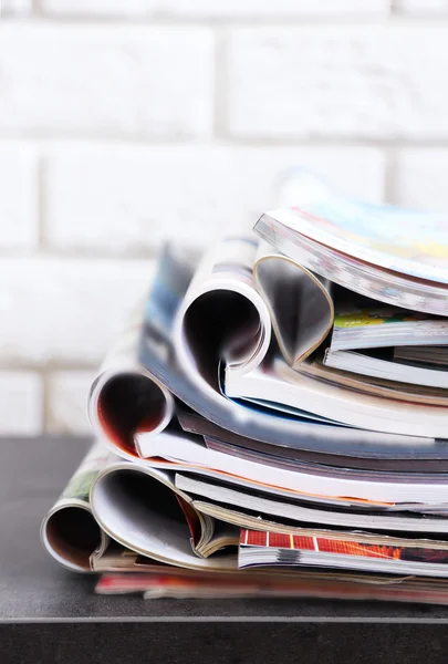 Stack of magazines on table — Stock Photo, Image