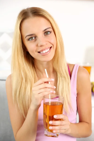 Young beautiful woman with apple juice — Stock Photo, Image
