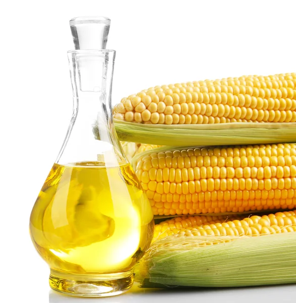 Fresh corn with bottle of oil isolated on white — Stock Photo, Image