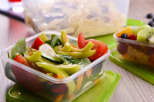 Tasty lunch in plastic containers — Stock Photo, Image