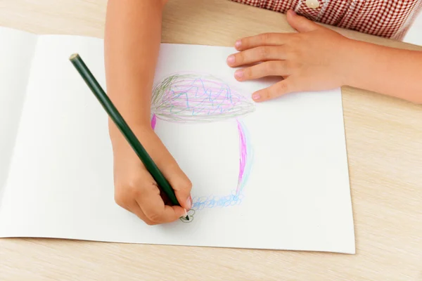 Little girl hands and her drawing — Stock Photo, Image