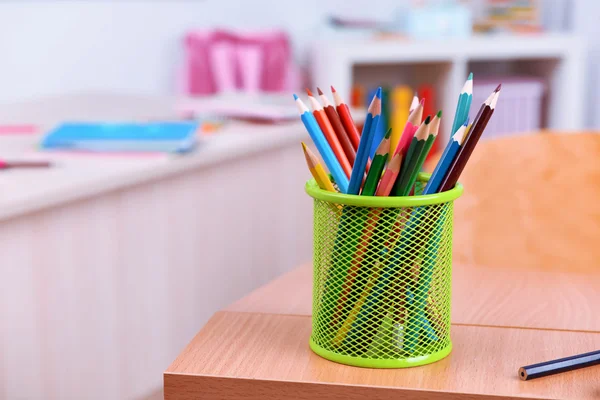 Desktop with cup of crayons — Stock Photo, Image