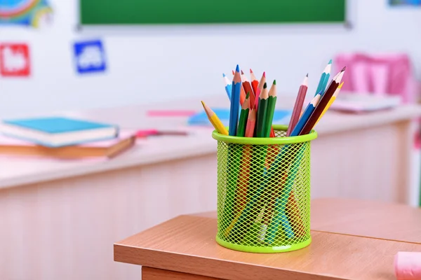 Desktop with cup of crayons — Stock Photo, Image