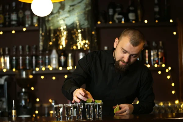 Bartender with tequila glasses — Stock Photo, Image