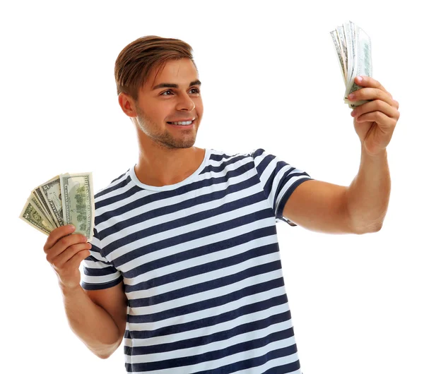 Handsome young man holding money isolated on white — Stock Photo, Image
