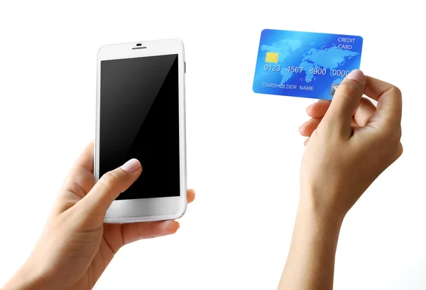 Manos sosteniendo Smartphone y tarjeta de crédito — Foto de Stock