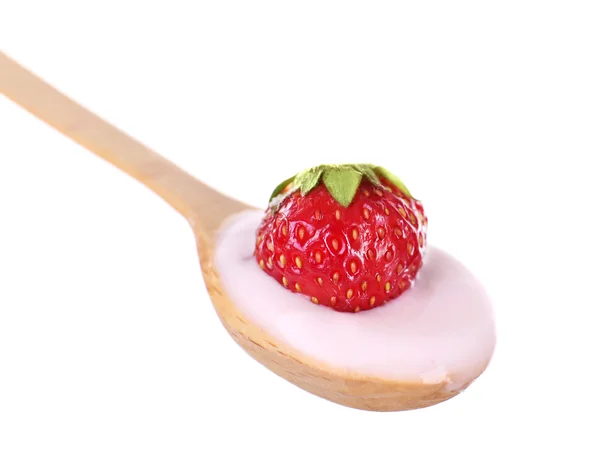 Delicious yogurt in spoon with strawberry isolated on white — Stock Photo, Image