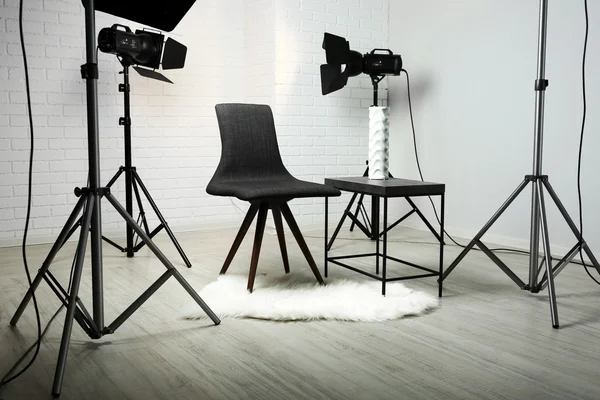 Photo studio with modern interior and lighting equipment