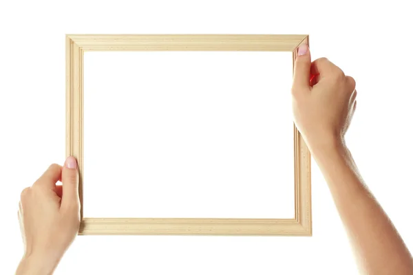 Mãos femininas com moldura de madeira, isoladas em branco — Fotografia de Stock